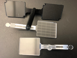 Injection molded polymer parts with cylindrical microlenses